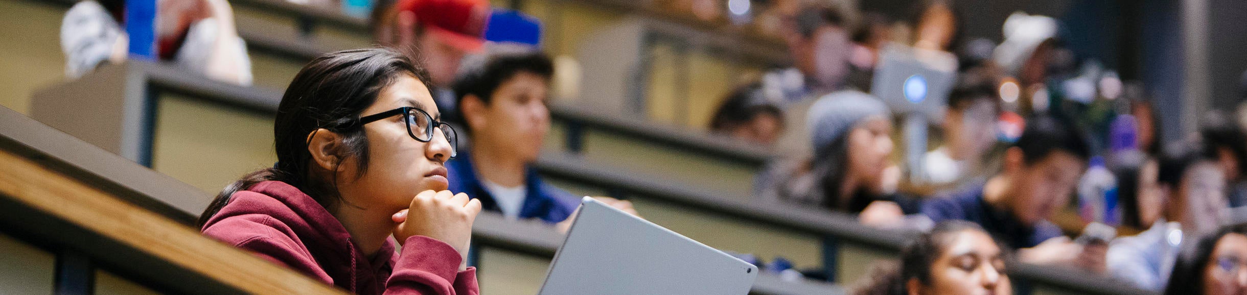 Students listening to a presentation in the Physics lecture hall